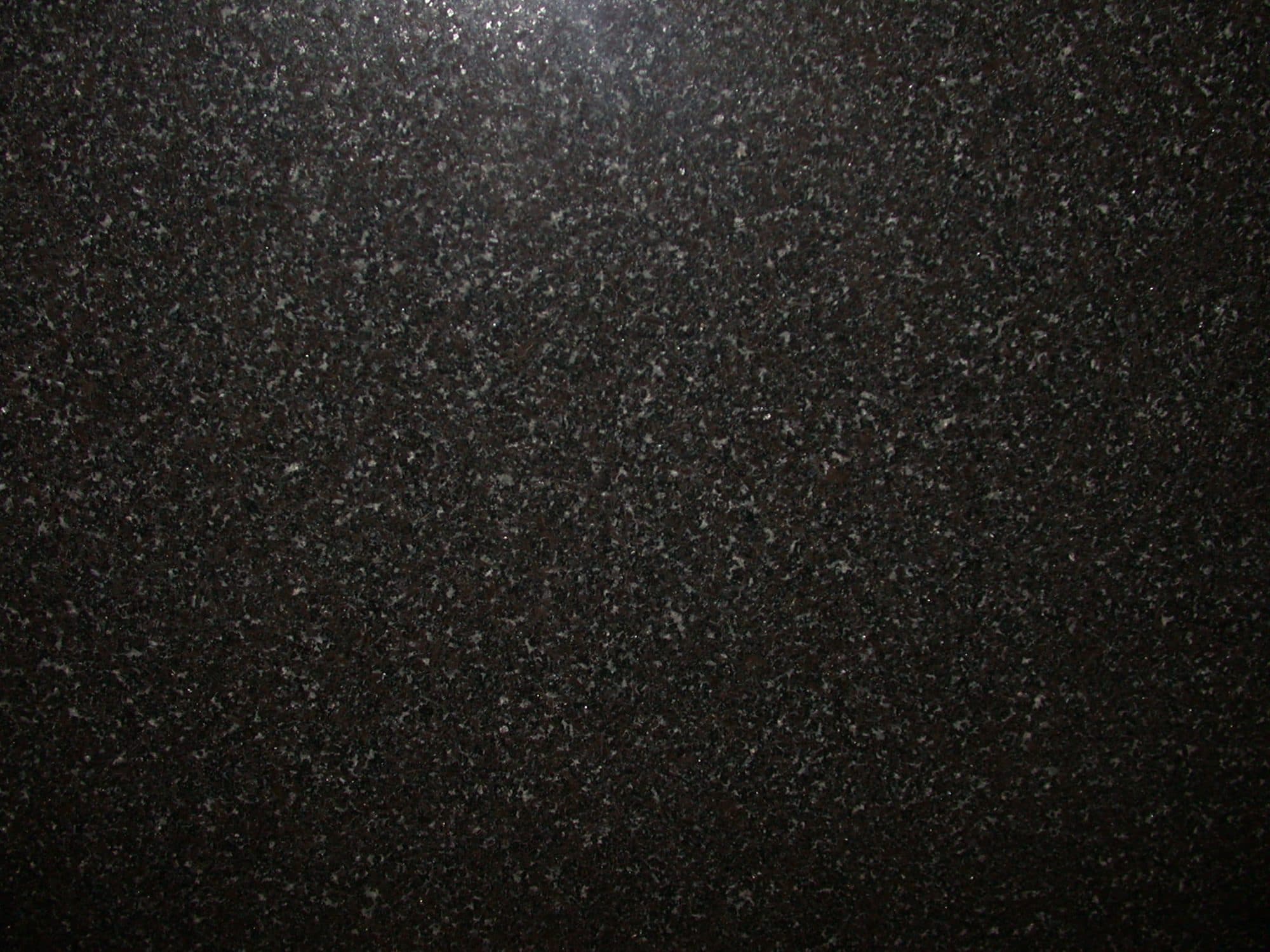 Polished black granite, the stone of the memorial wall