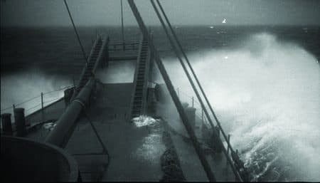 A ship's deck taking heavy seas over the rail